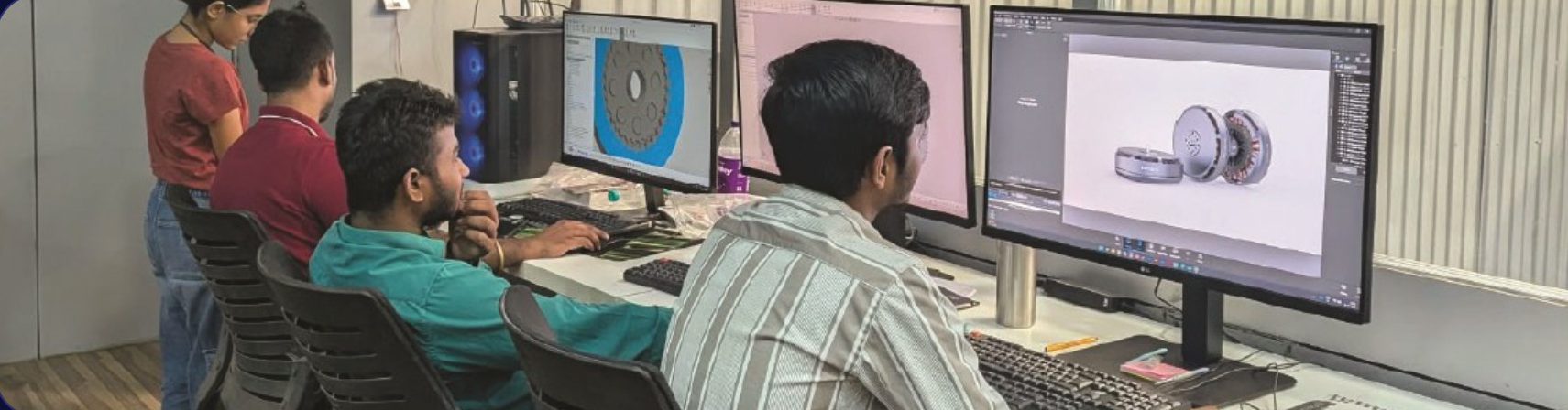 EYDelta engineers designing motors at workstations